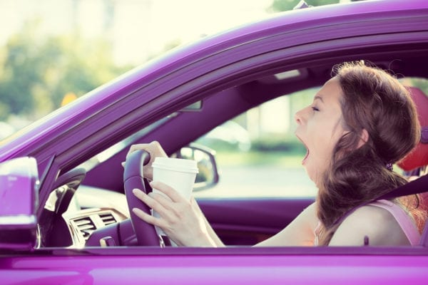 woman driving a purple car