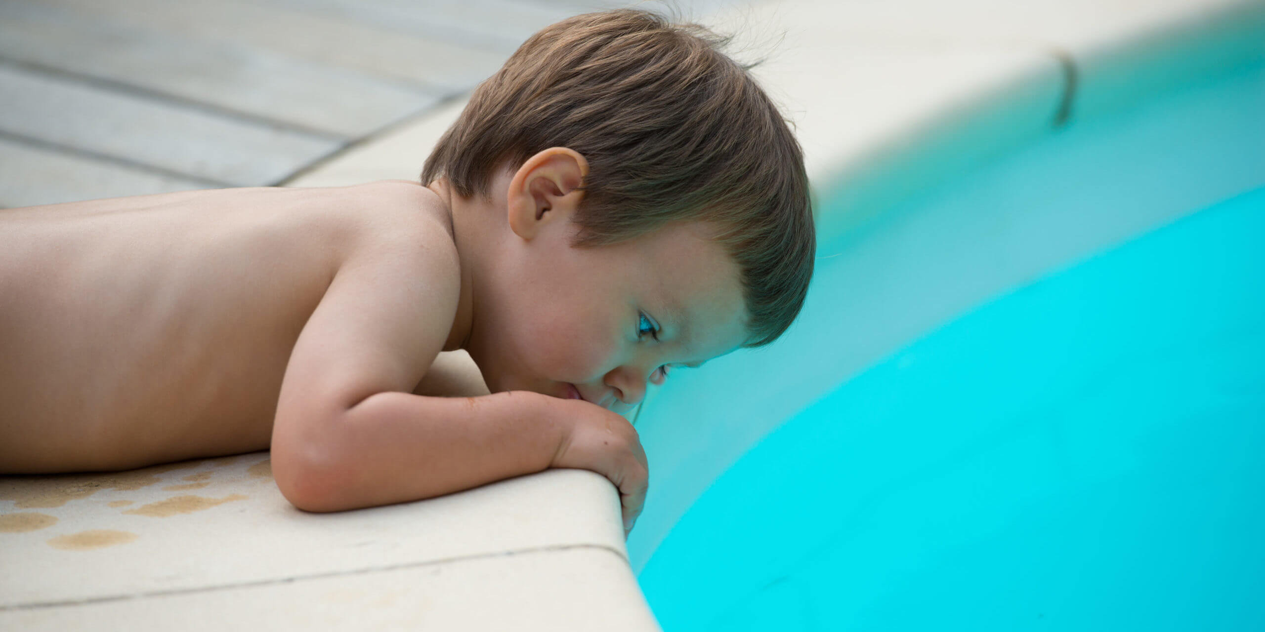 Child beside the pool